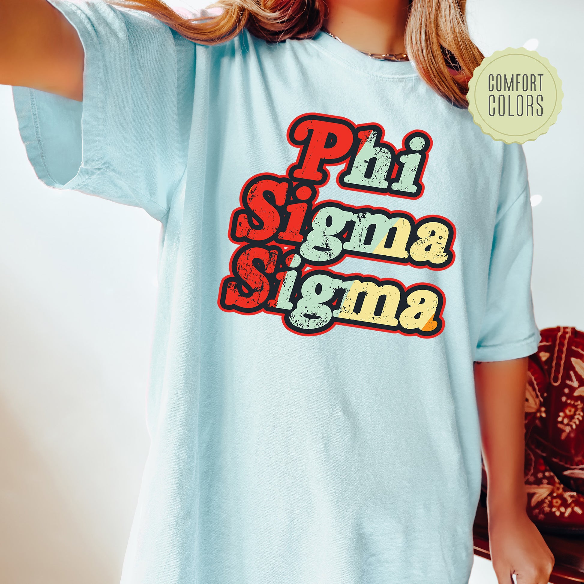 a young girl wearing a phi sigma shirt