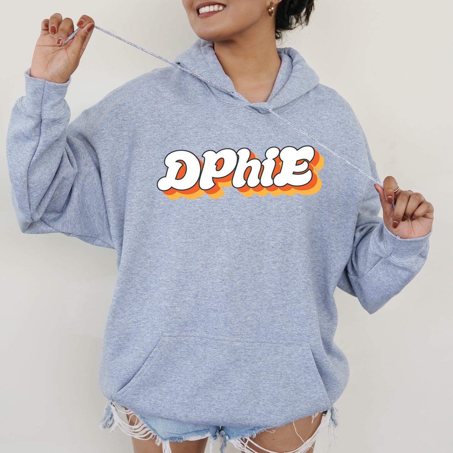 a woman in a blue hoodie with the word dppie on it