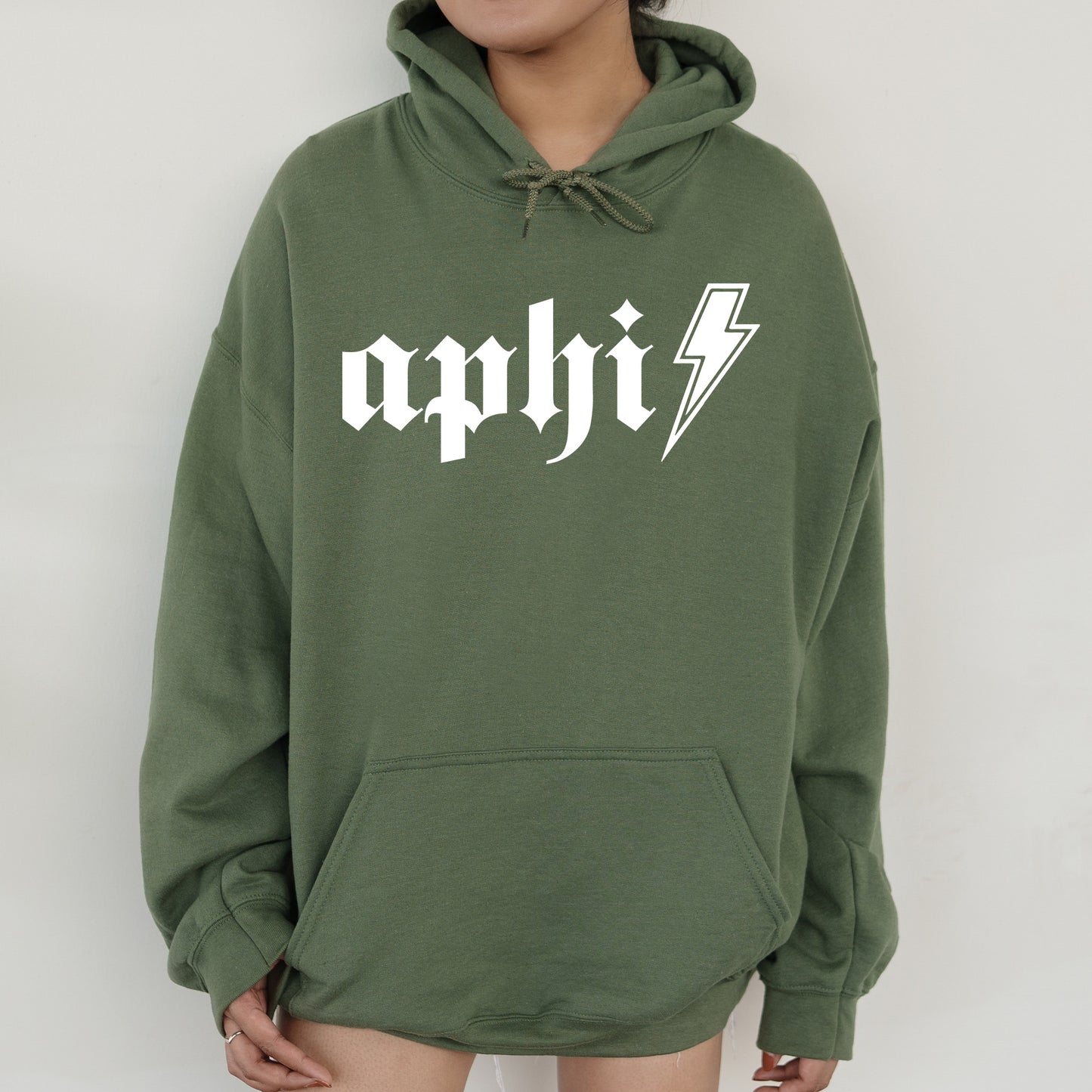 a person wearing a green hoodie with a lightning bolt on it