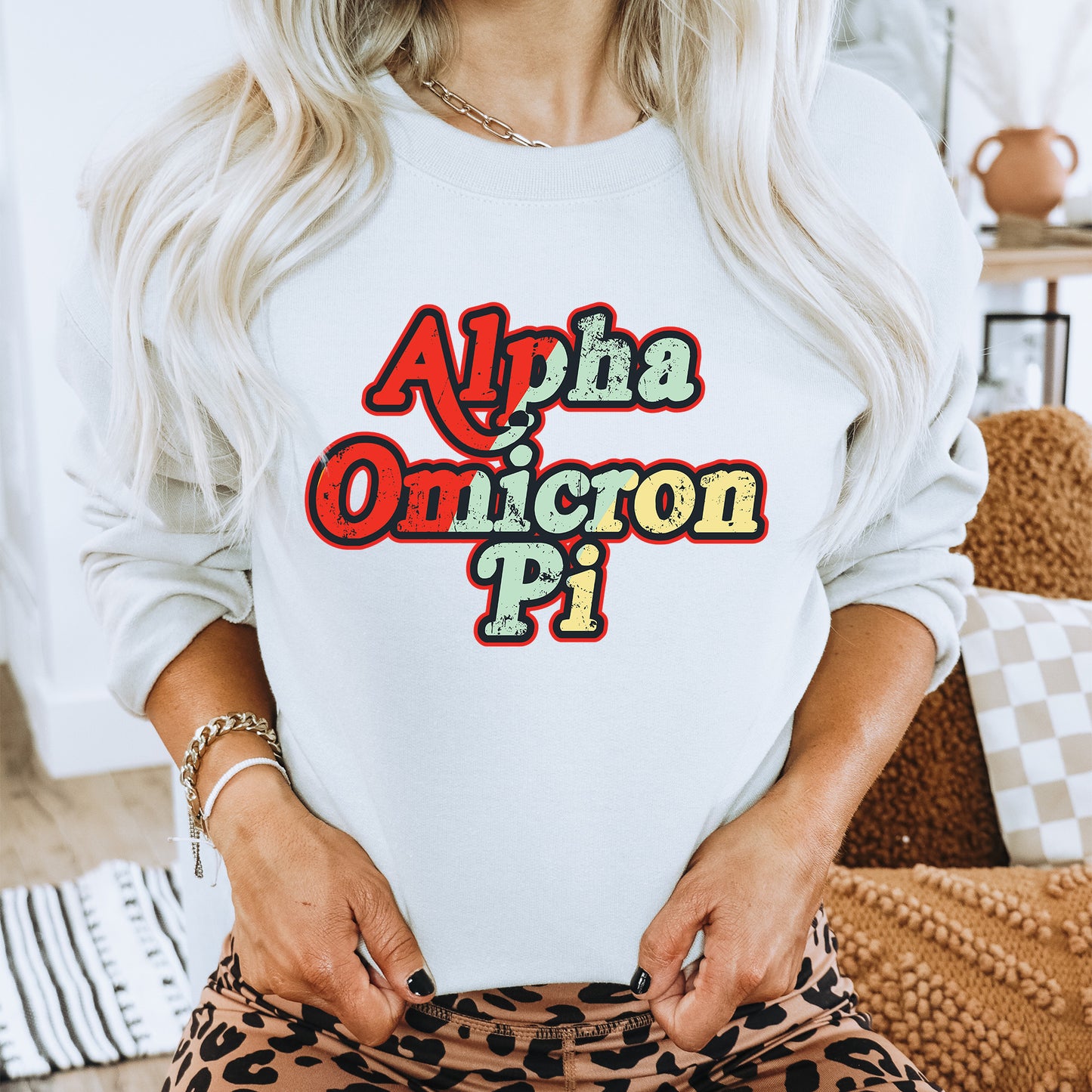 a woman with blonde hair wearing a white sweatshirt