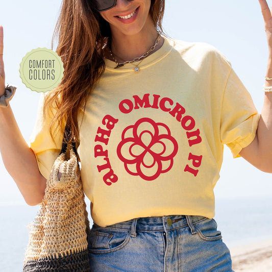 a woman in a yellow shirt holding up a peace sign