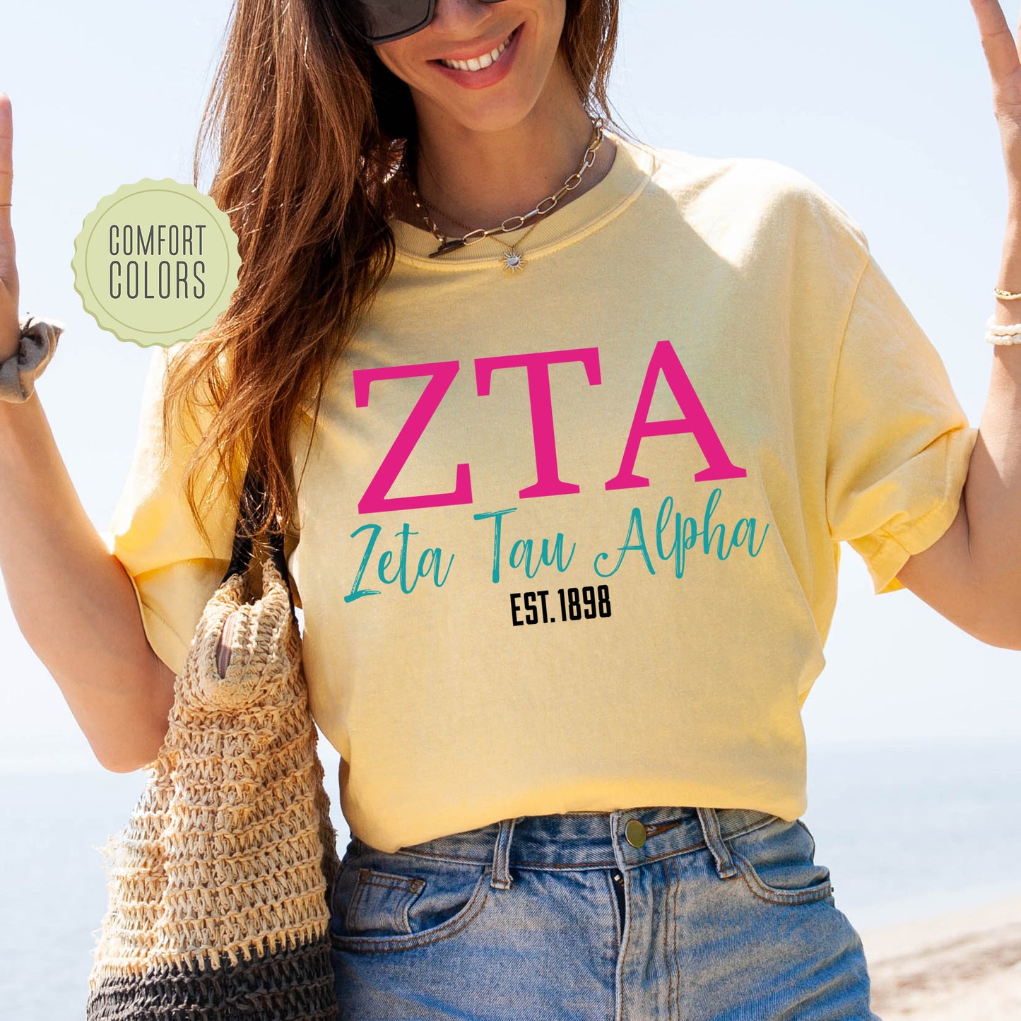 a woman wearing a t - shirt that says zita tau aloha