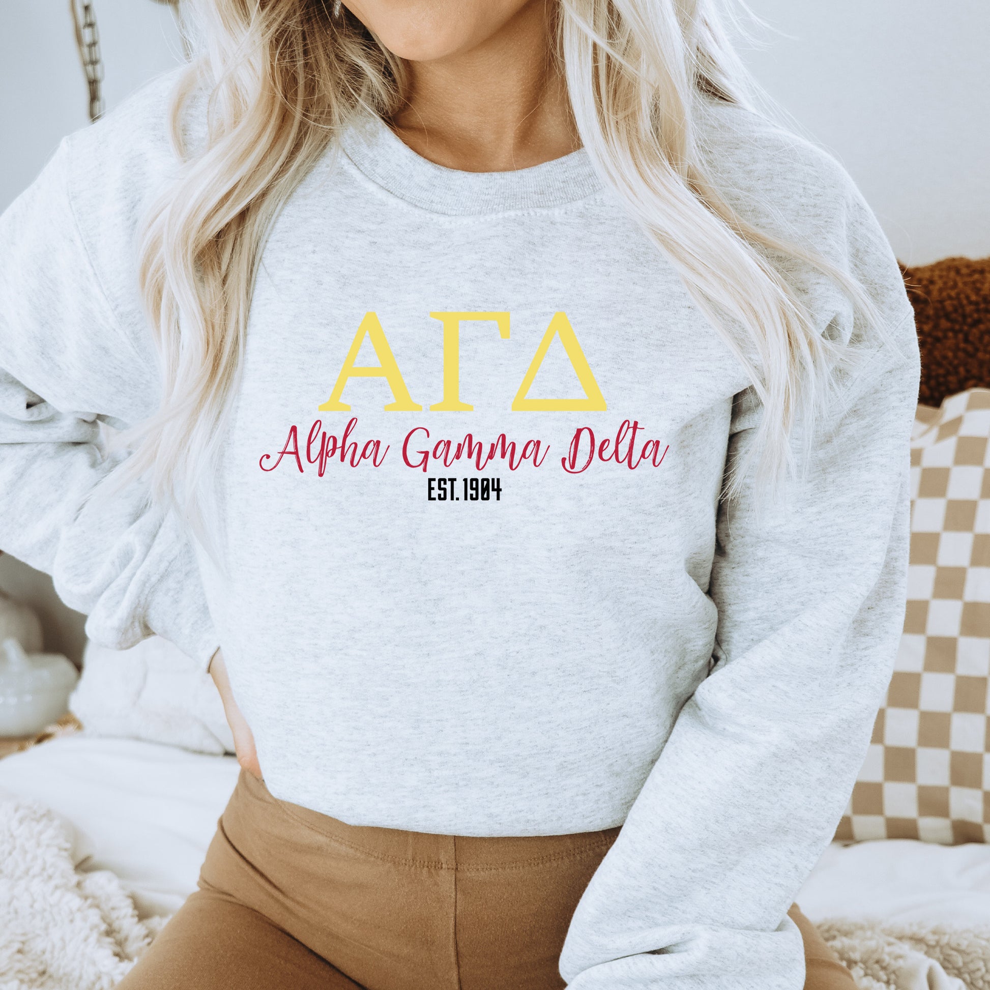a woman wearing a sweatshirt that says atta