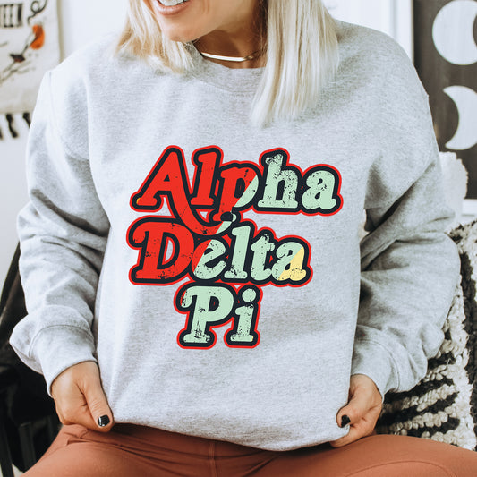 a woman wearing a sweatshirt that says aloh delta pi