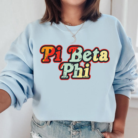 a woman wearing a blue sweatshirt that says pi beta phi