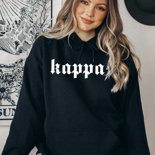 a woman wearing a black hoodie with the word kappo printed on it