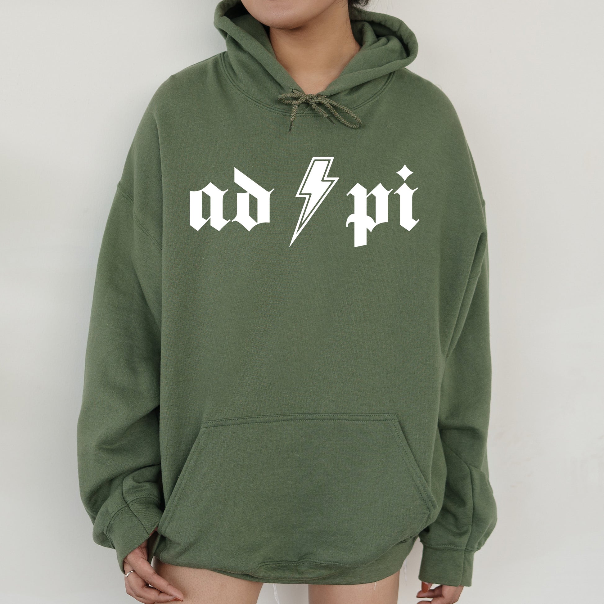 a person wearing a green hoodie with a lightning bolt on it