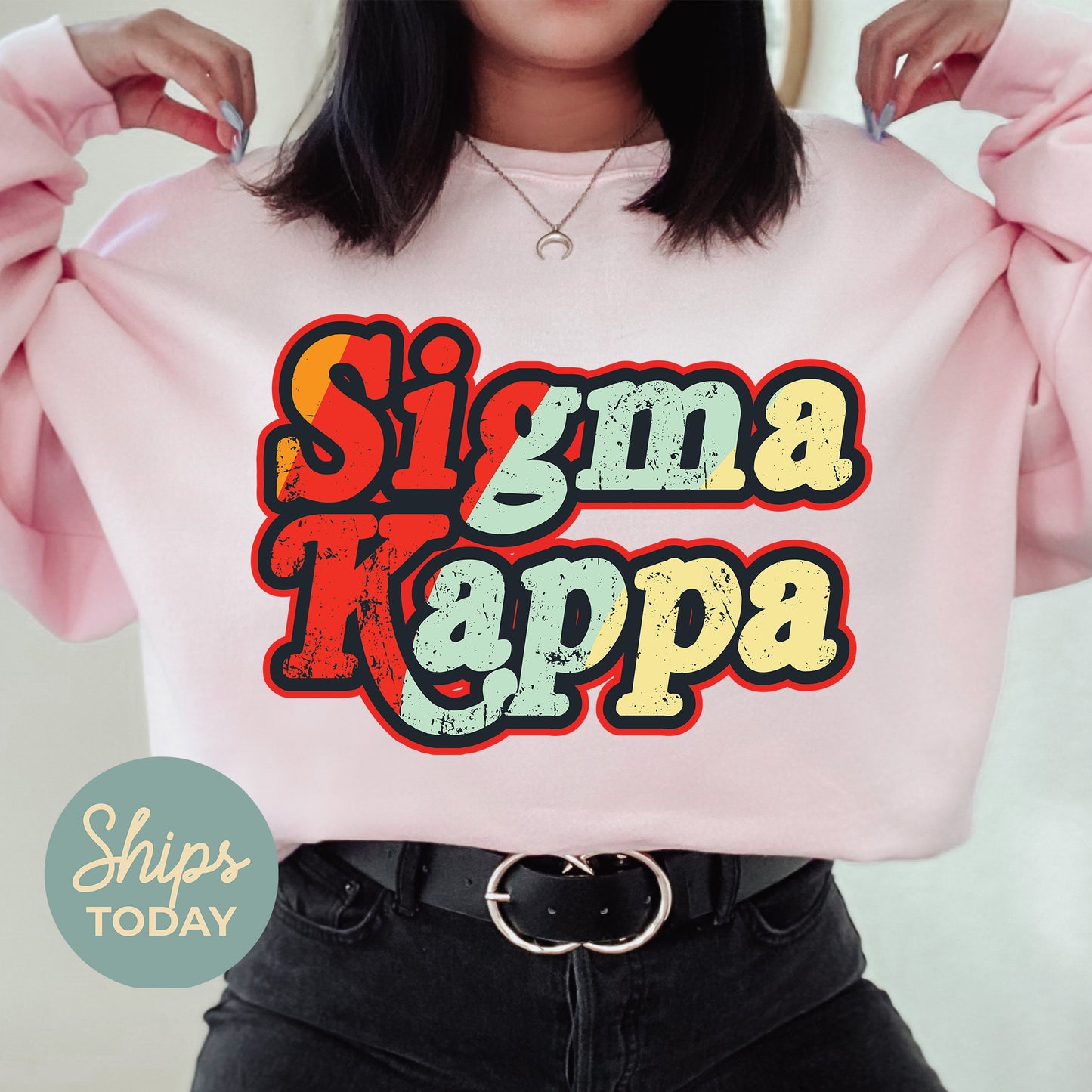 a woman wearing a pink shirt that says singma kappa