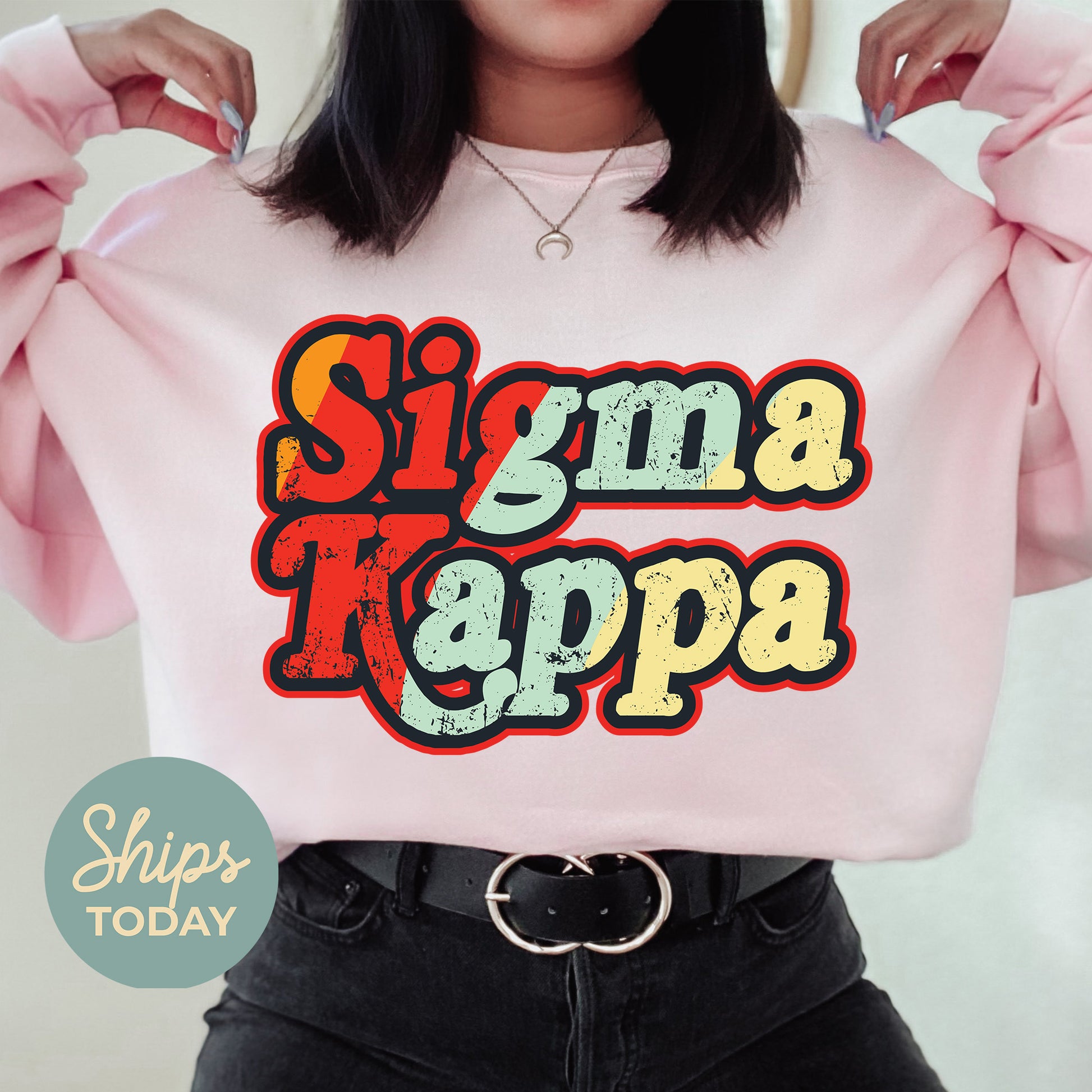 a woman wearing a pink shirt that says singma kappa