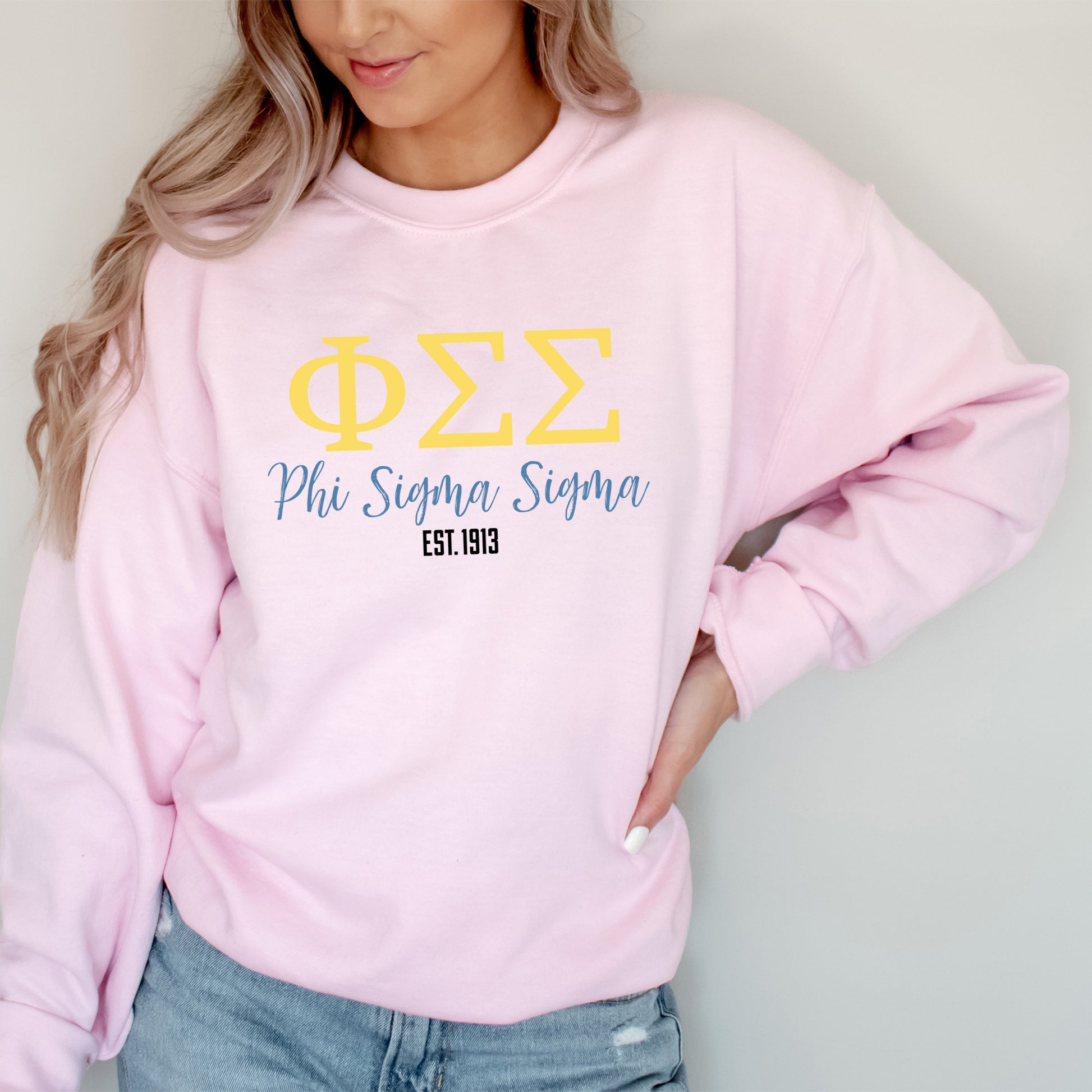 a woman wearing a pink phi phi long sleeve shirt