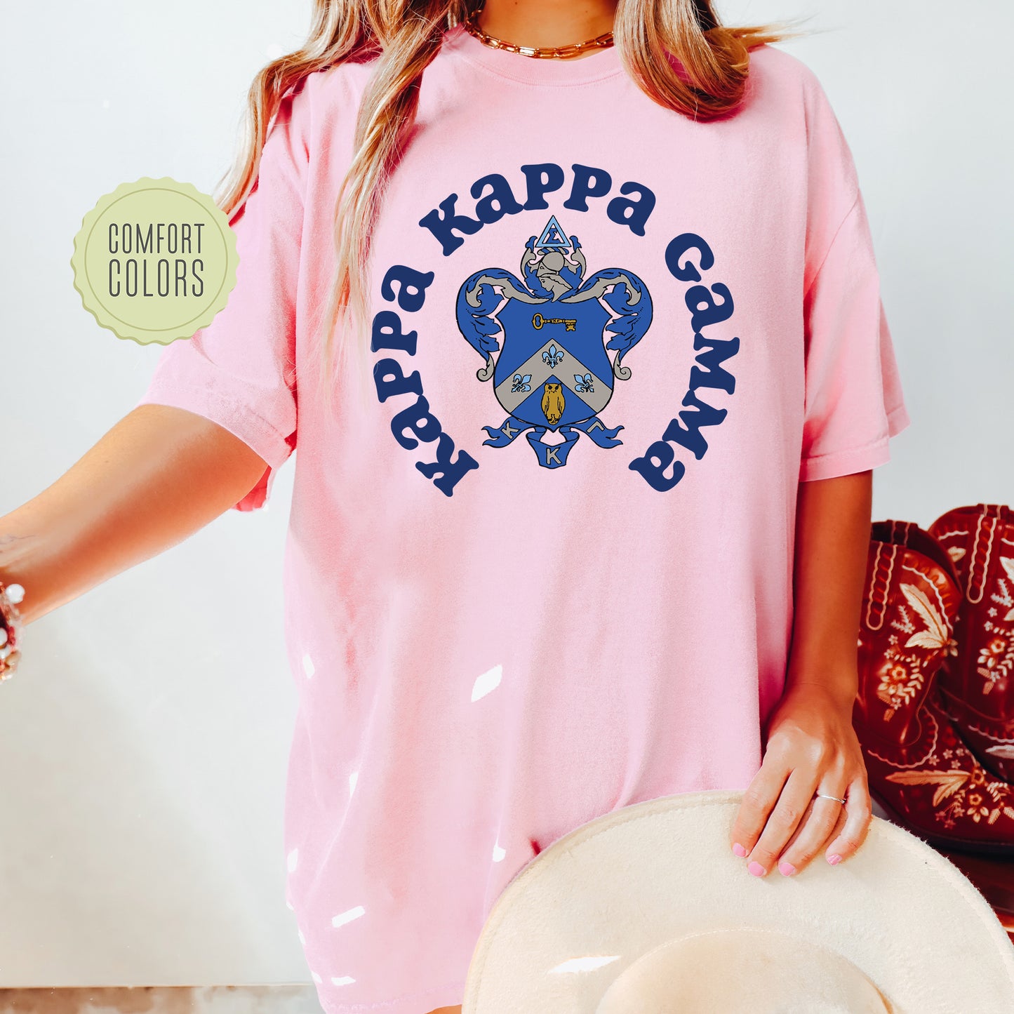 a woman wearing a pink shirt and a cowboy hat