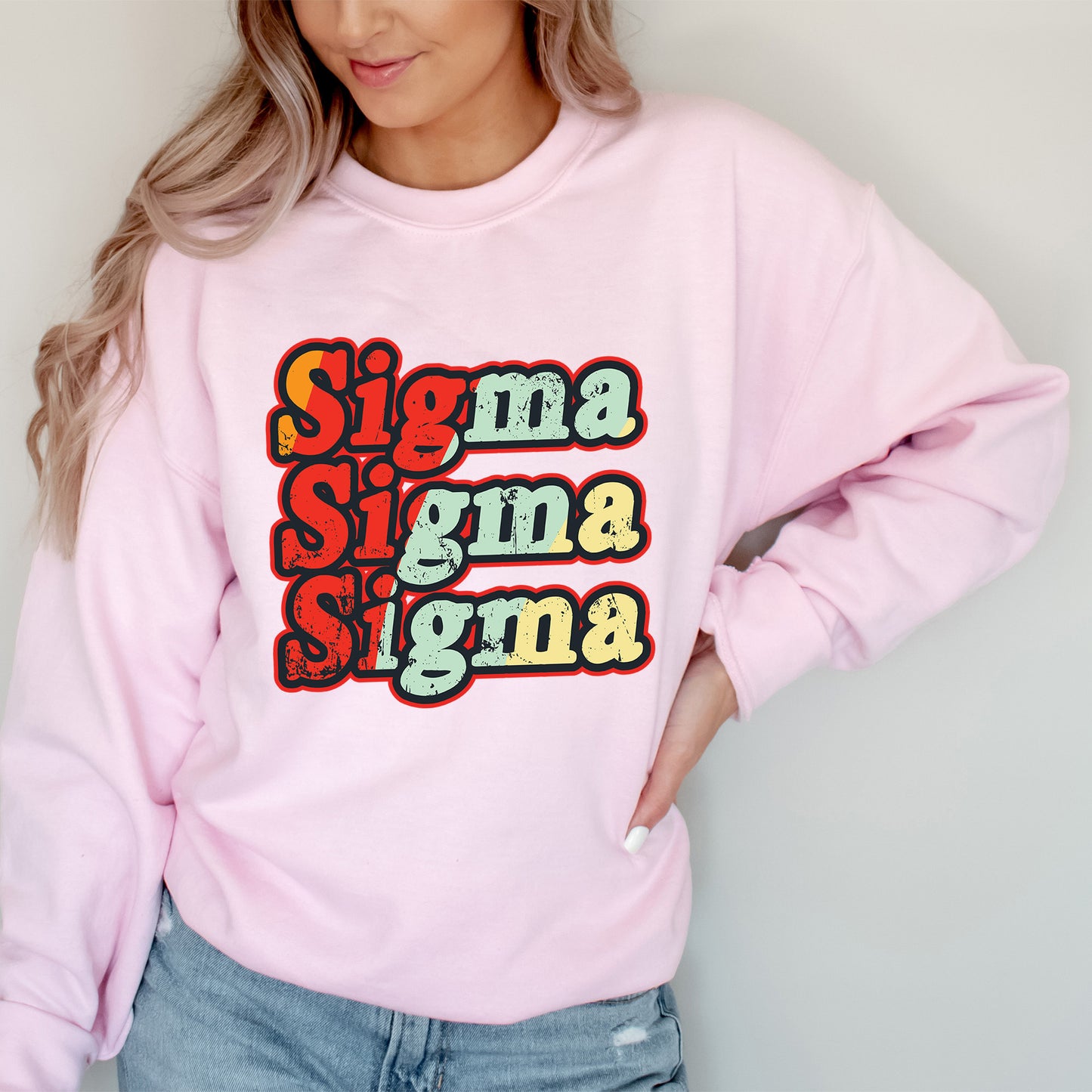 a woman wearing a pink sweatshirt with the words stigma stigma stigma on it