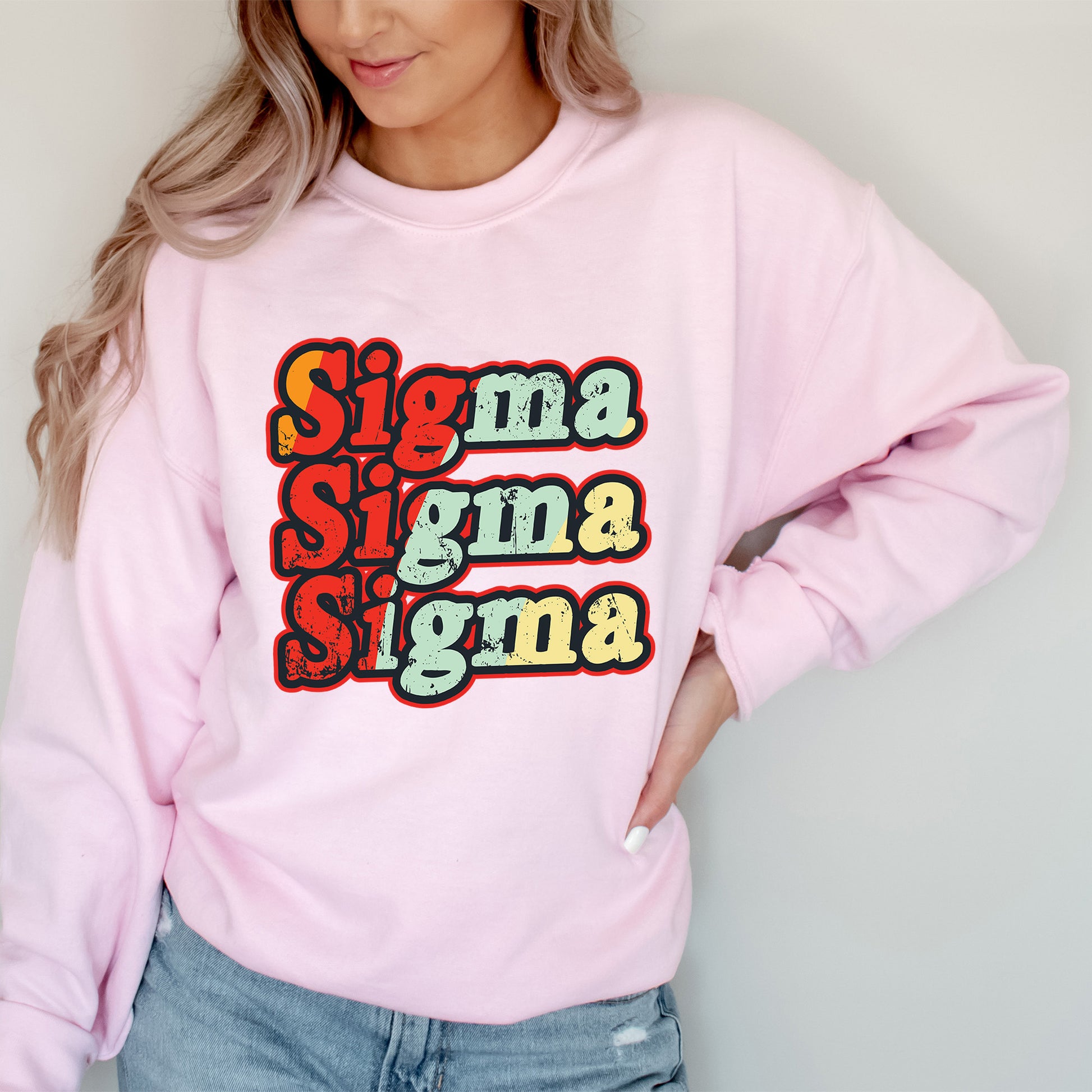 a woman wearing a pink sweatshirt with the words stigma stigma stigma on it