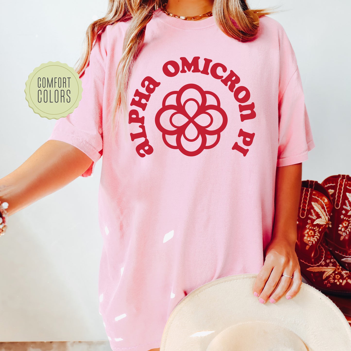 a woman wearing a pink shirt and hat