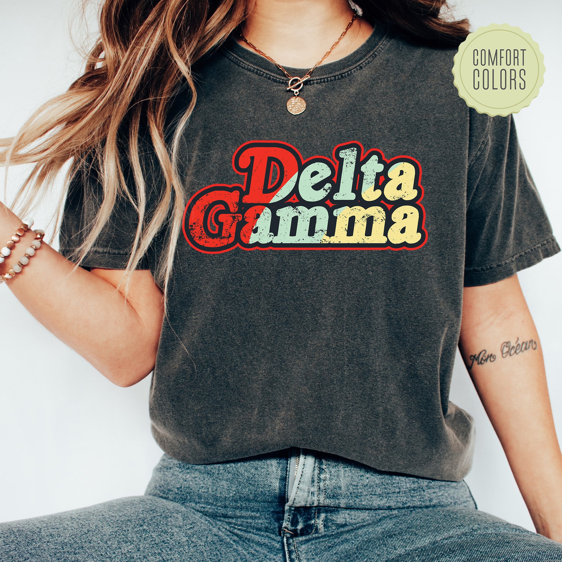 a woman wearing a shirt that says delta gumma
