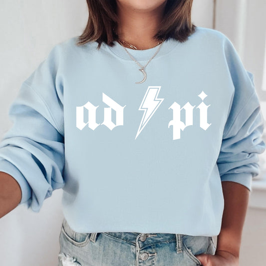 a woman wearing a blue sweatshirt with a lightning bolt on it