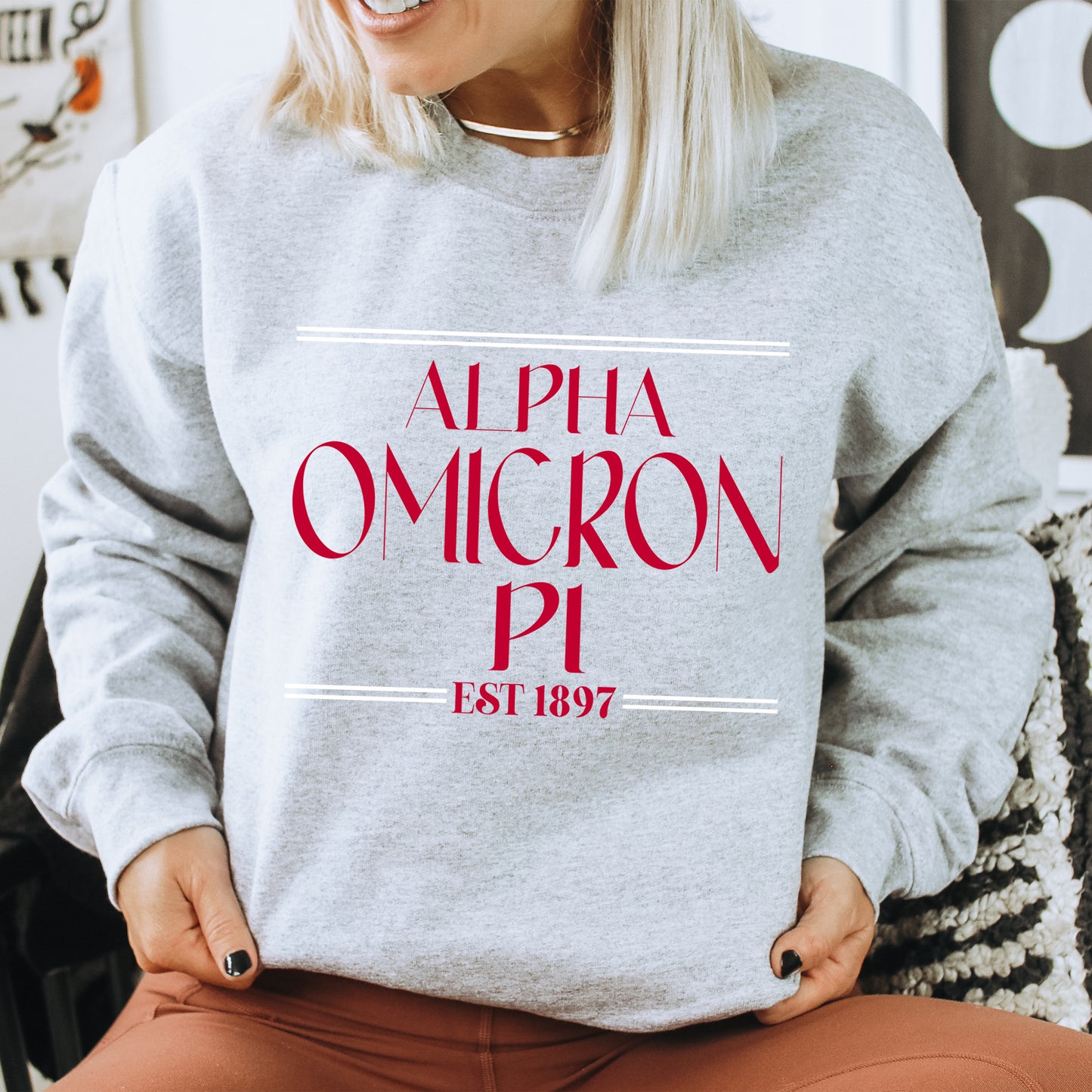 a woman wearing a sweatshirt that says, alpha omgron pi