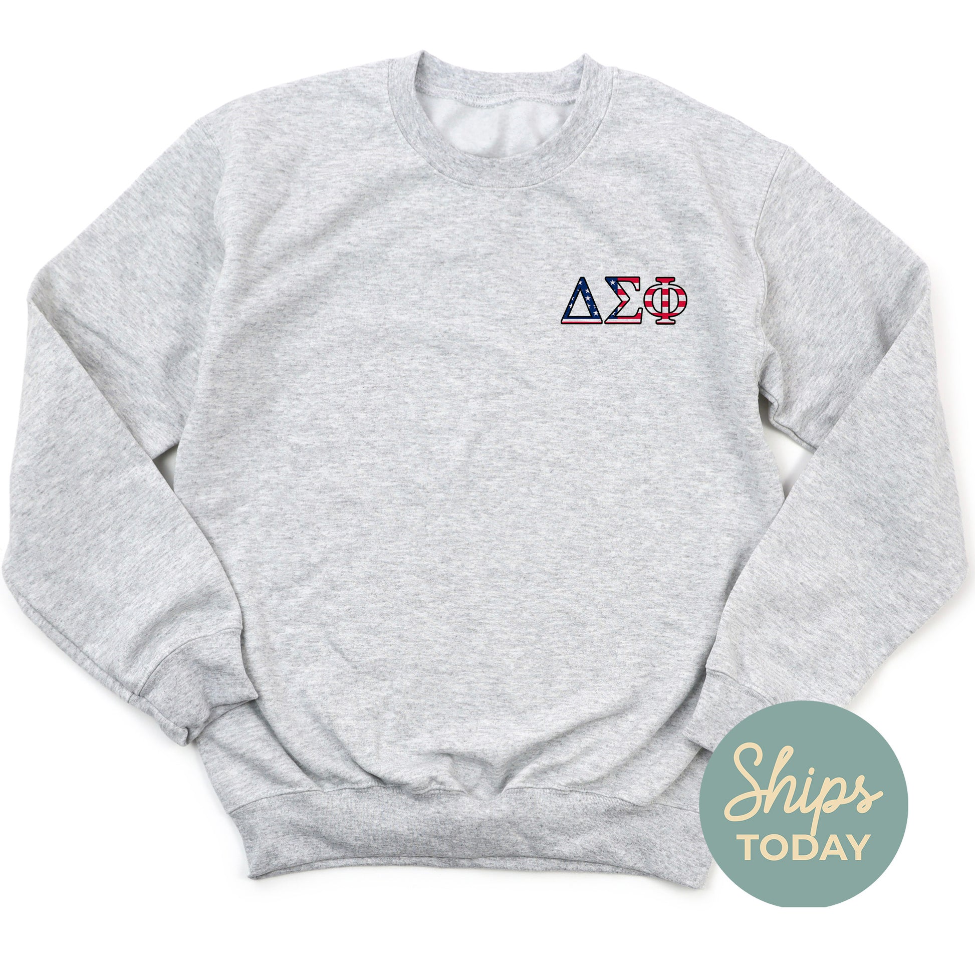 a grey sweatshirt with the letters a and d on it
