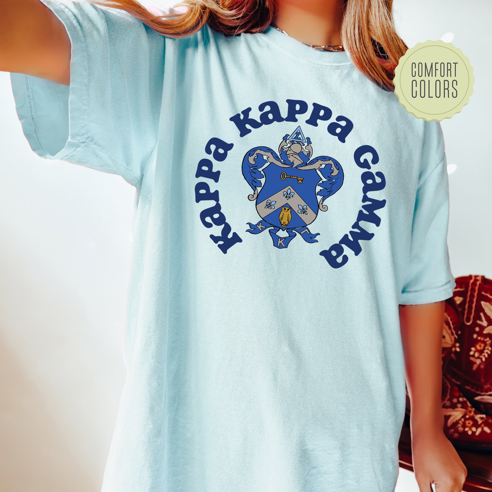 a young girl wearing a blue shirt with a shamrock on it