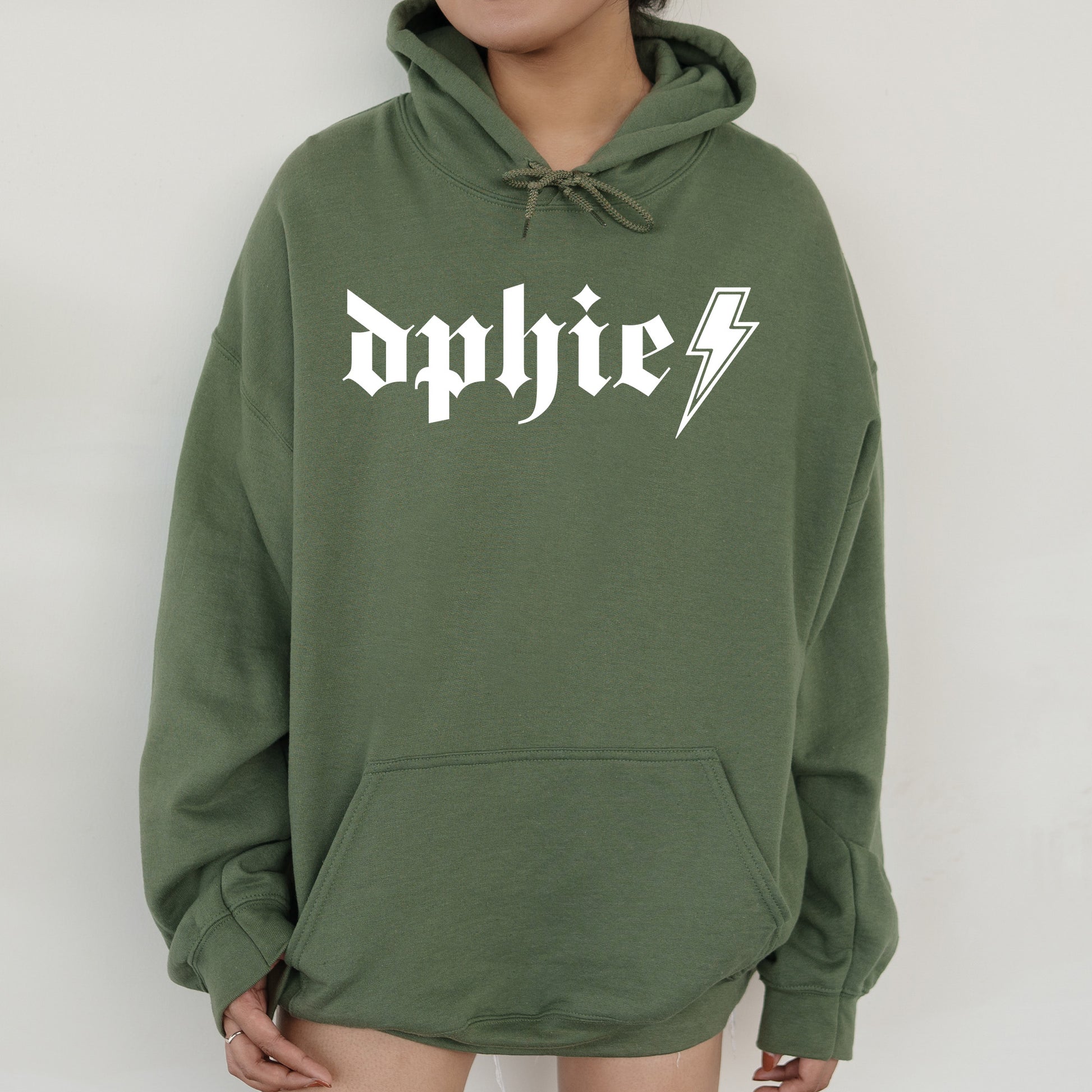 a person wearing a green hoodie with a lightning bolt on it