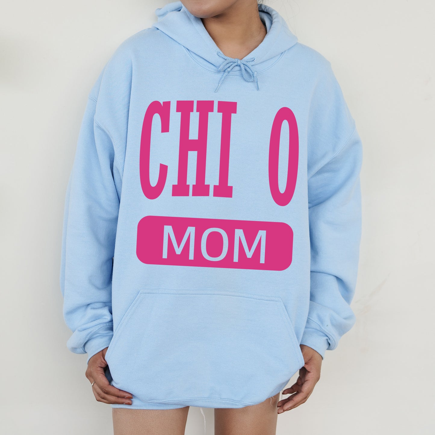 a woman wearing a blue hoodie with the words chi chi on it