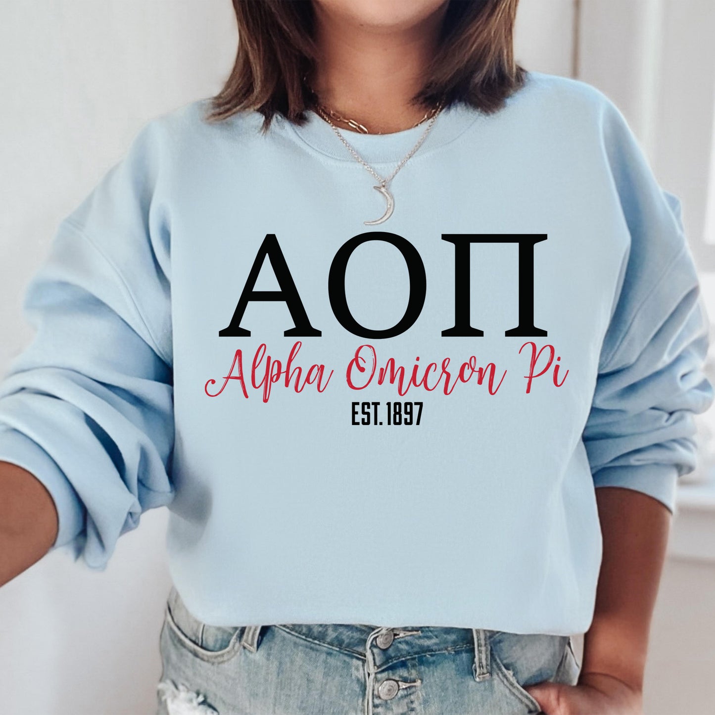 a woman wearing a blue sweatshirt with the word aoi on it