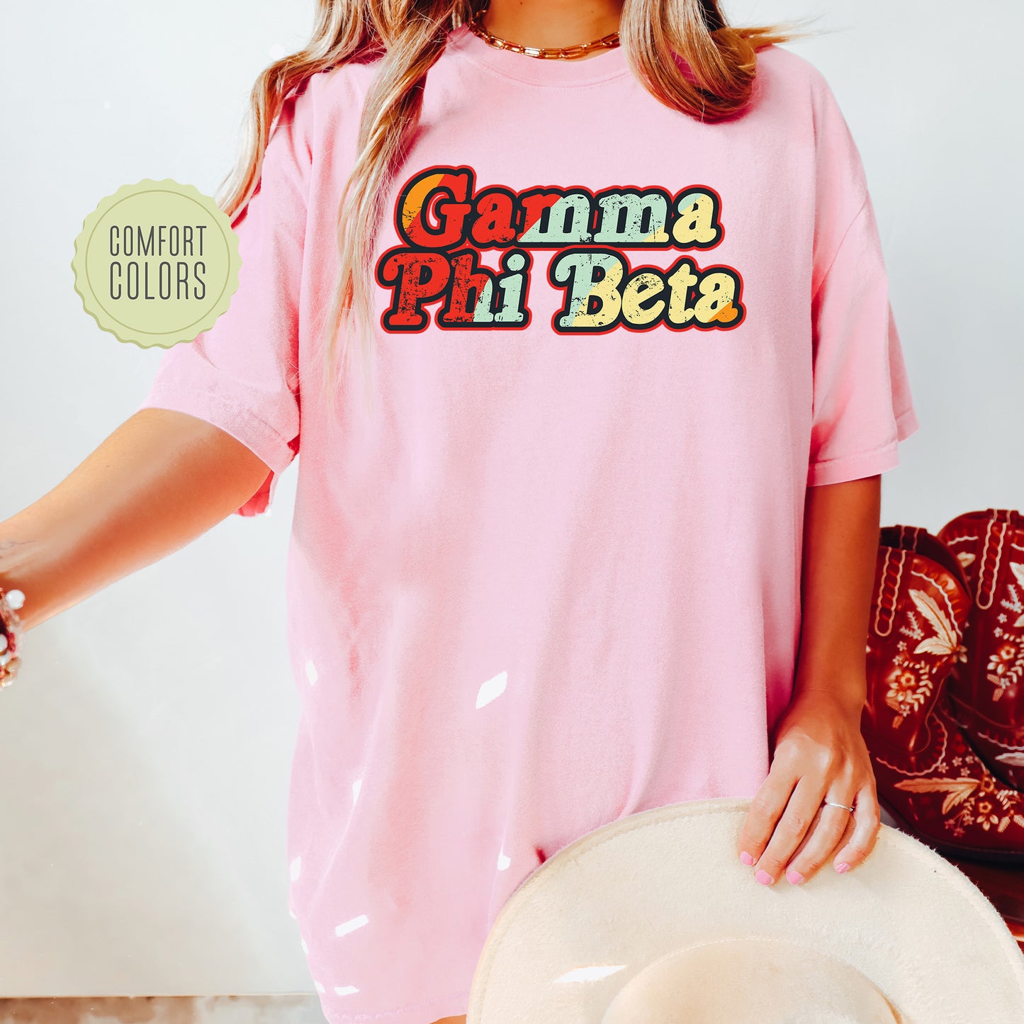 a woman wearing a pink shirt and hat