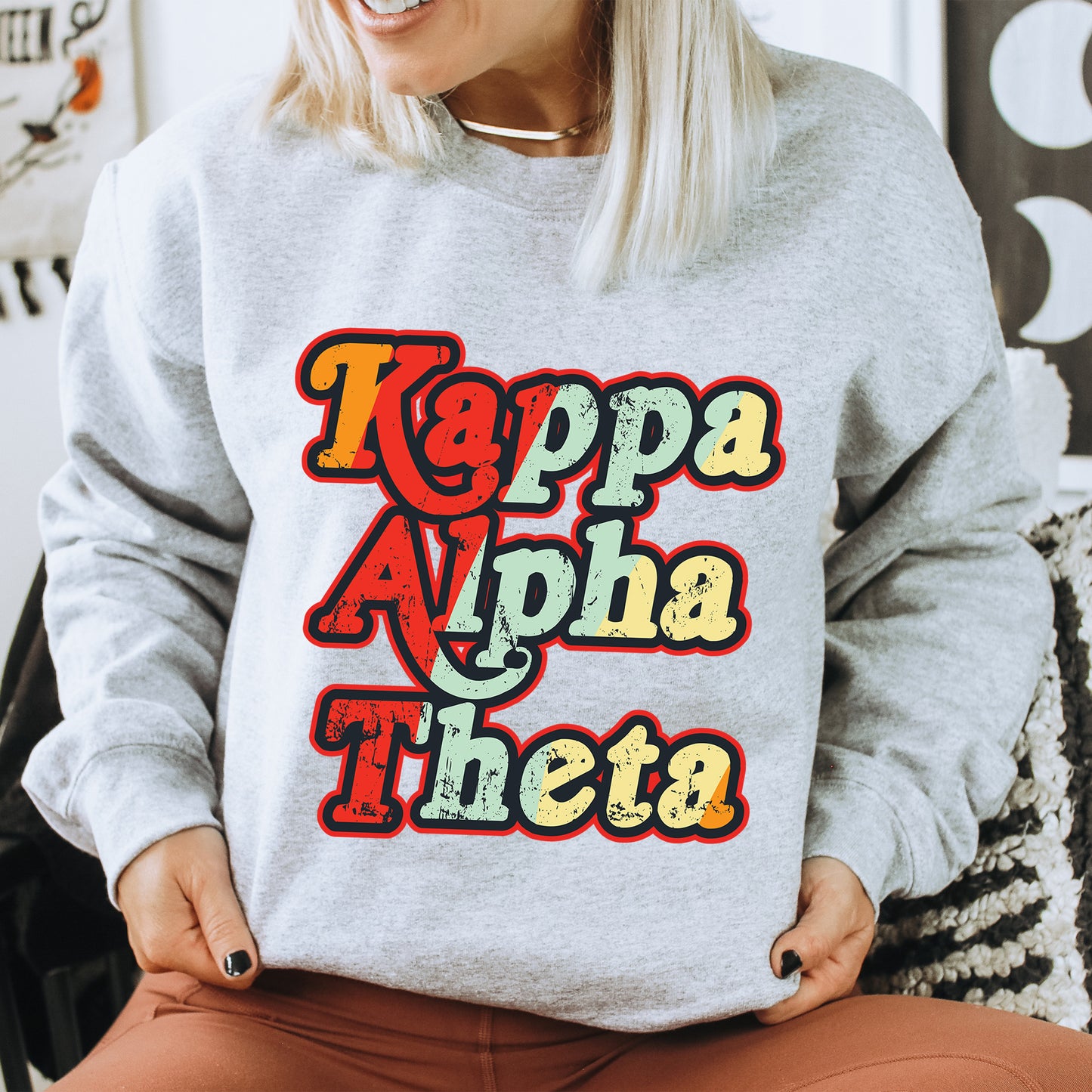 a woman wearing a sweatshirt that says kapa ah aha thisa