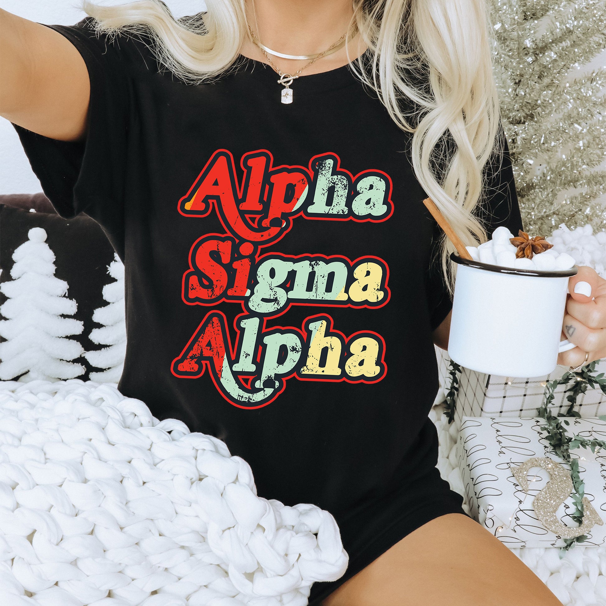 a woman sitting on a couch holding a cup of coffee