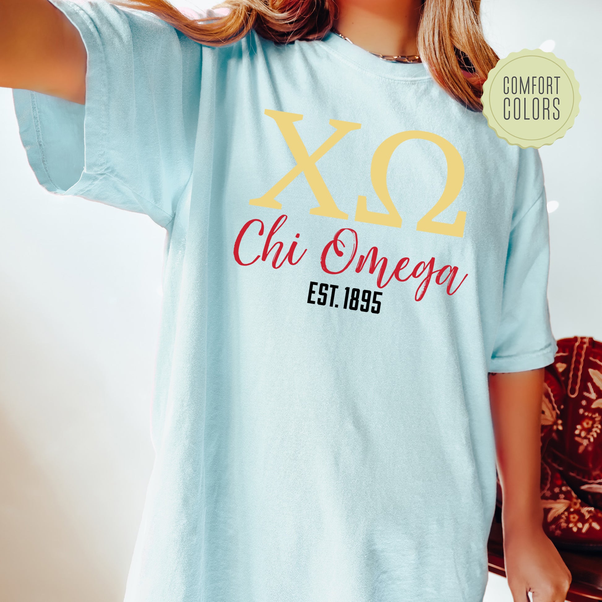 a woman wearing a t - shirt that says xo chi chi chi chi chi