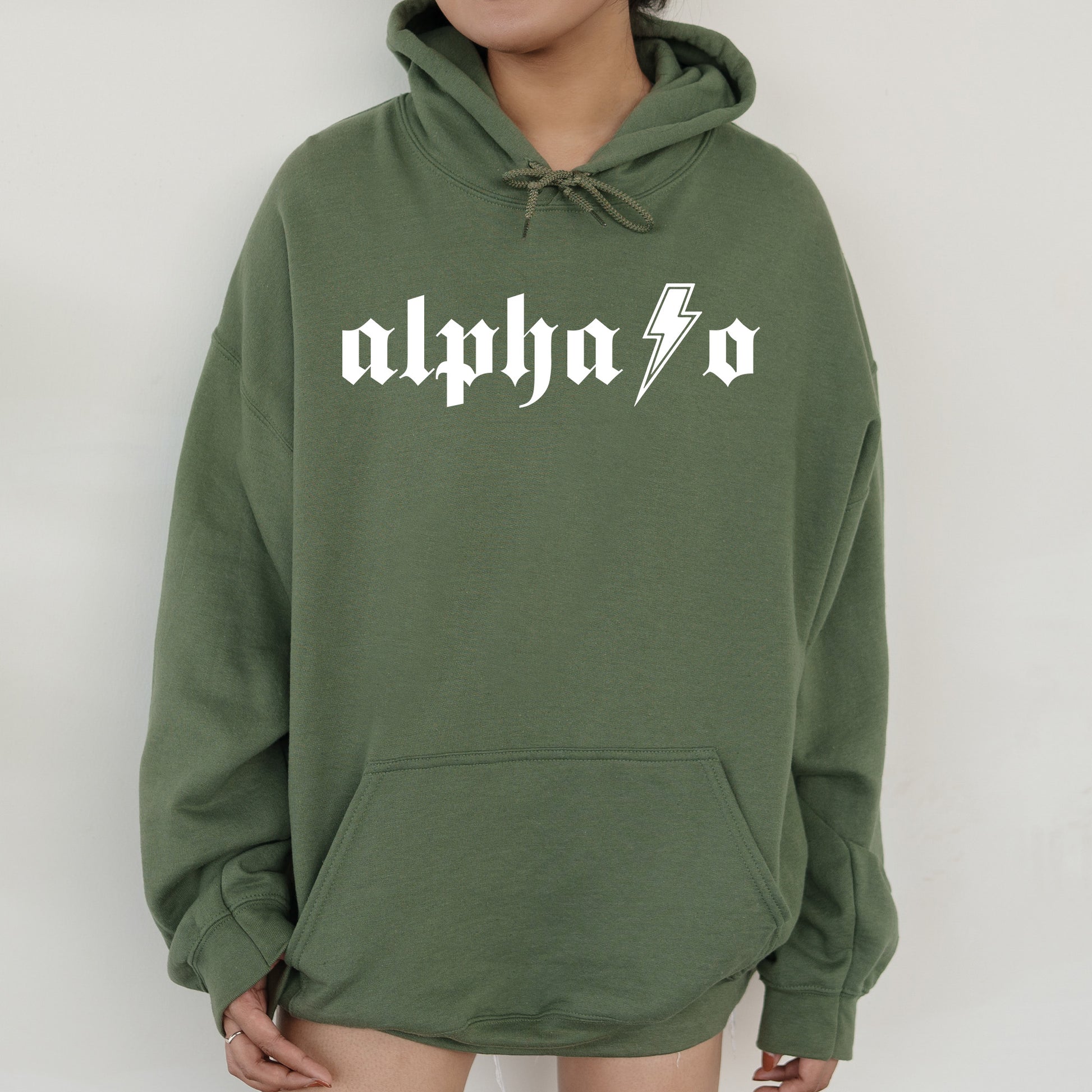 a person wearing a green hoodie with the word alphon on it