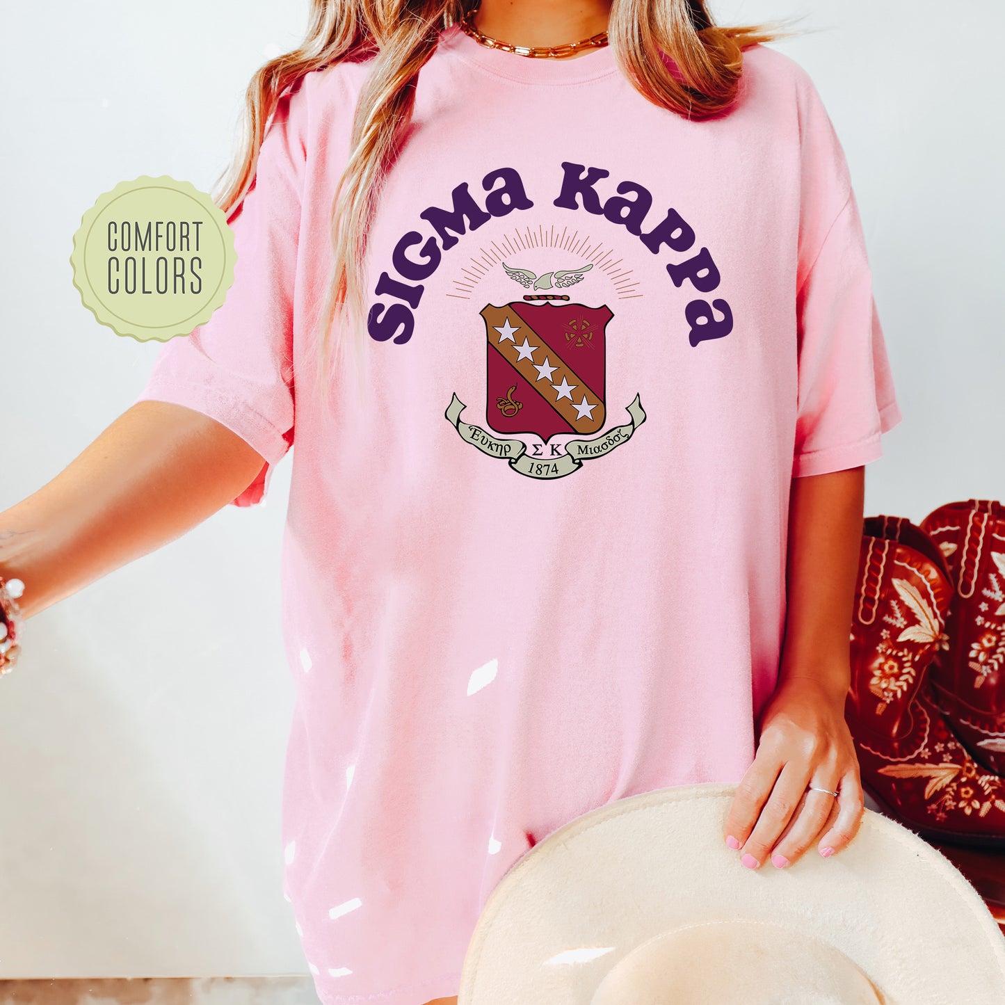 a woman wearing a pink shirt and hat