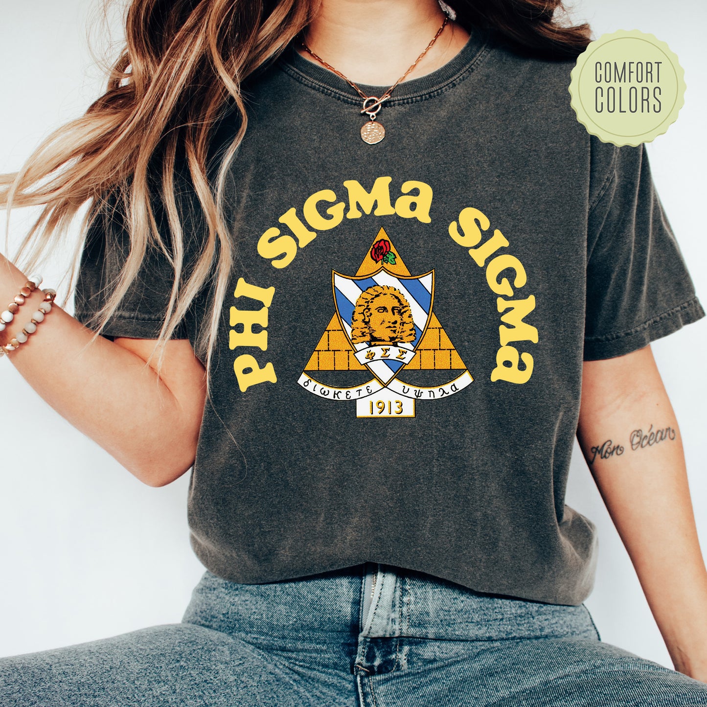 a woman wearing a shirt that says, phi sigma sign