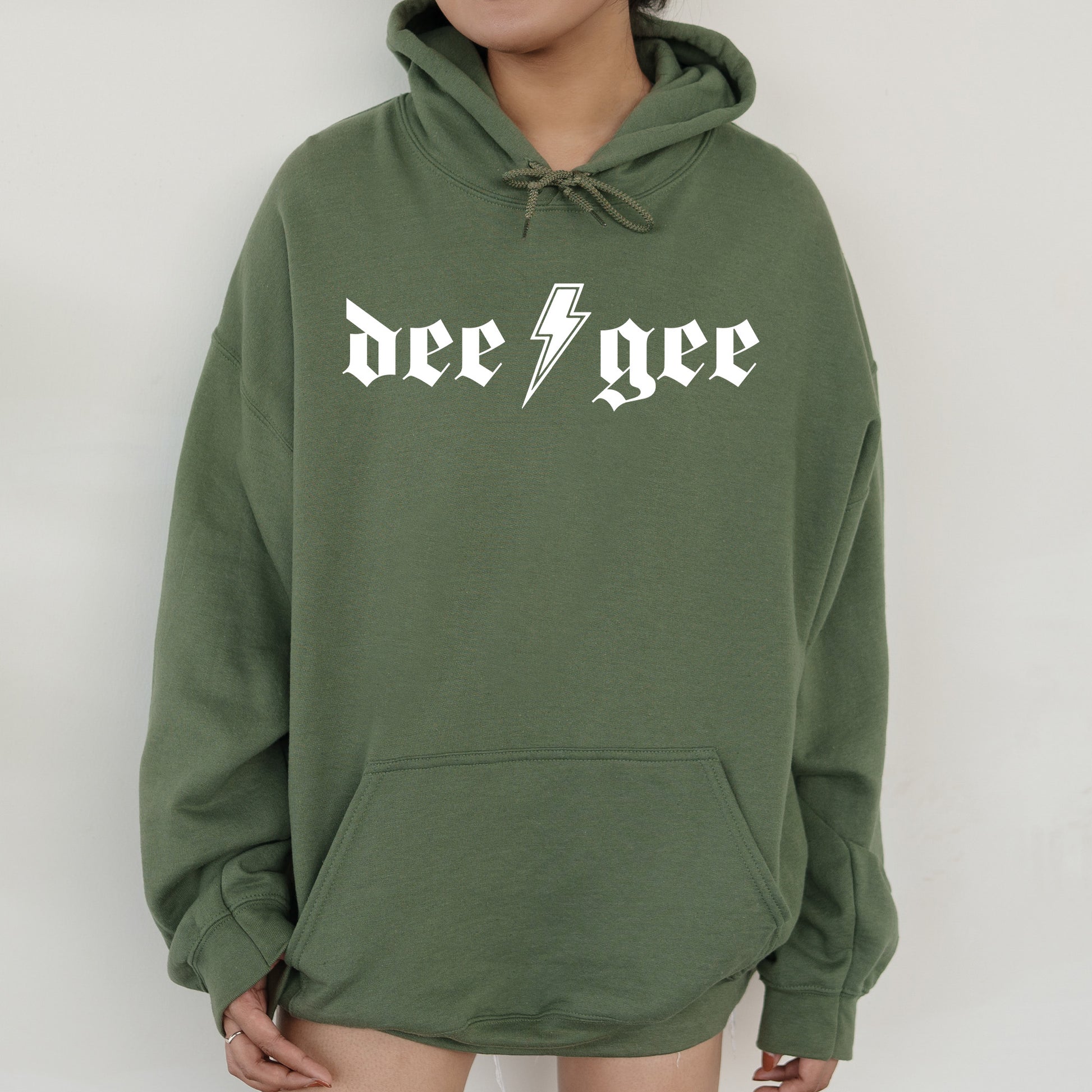a person wearing a green hoodie with a lightning bolt on it