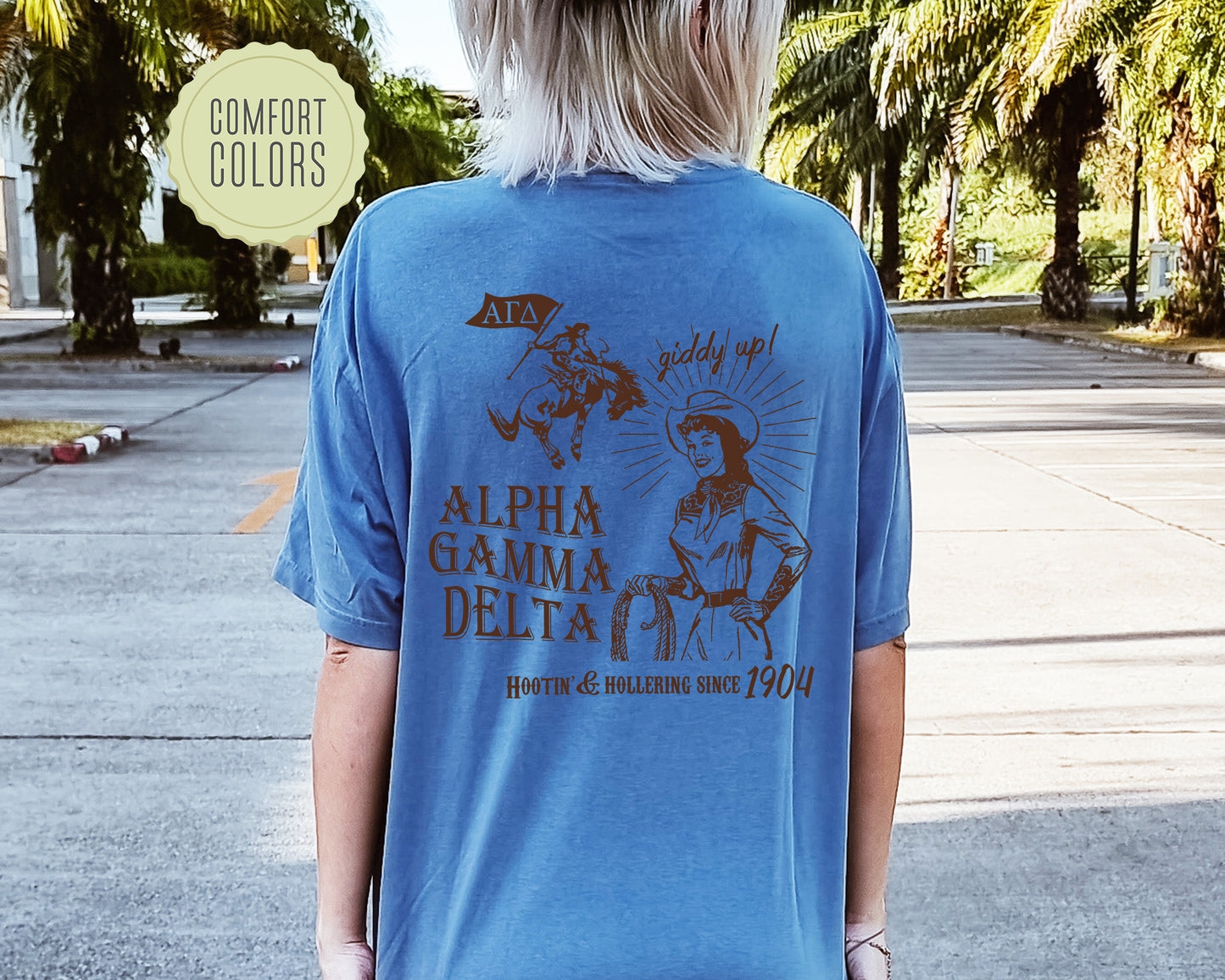 a woman wearing a blue shirt with a picture of a woman riding a horse