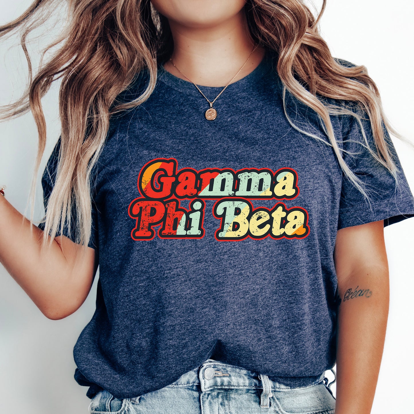 a woman wearing a t - shirt that says gama pii beta
