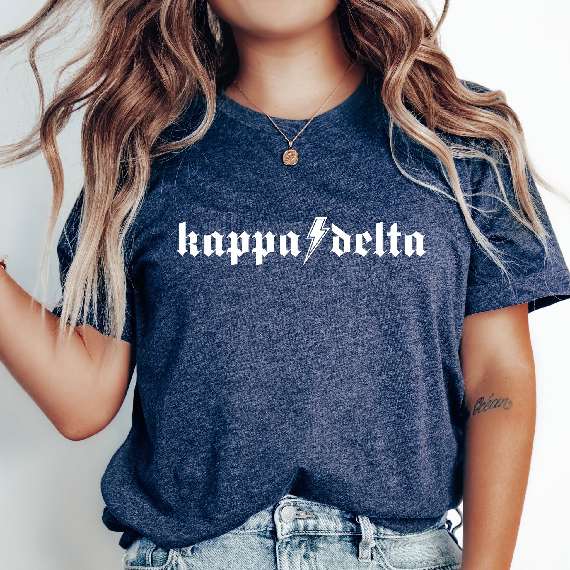 a woman wearing a t - shirt with the word happy delta printed on it