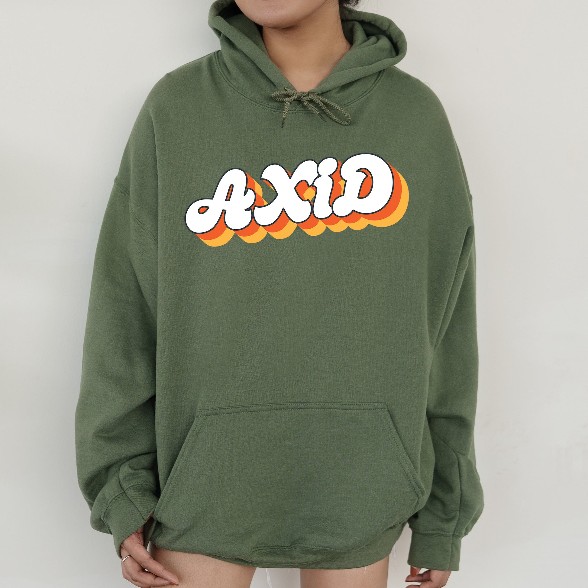 a person wearing a green hoodie with the word ajax printed on it