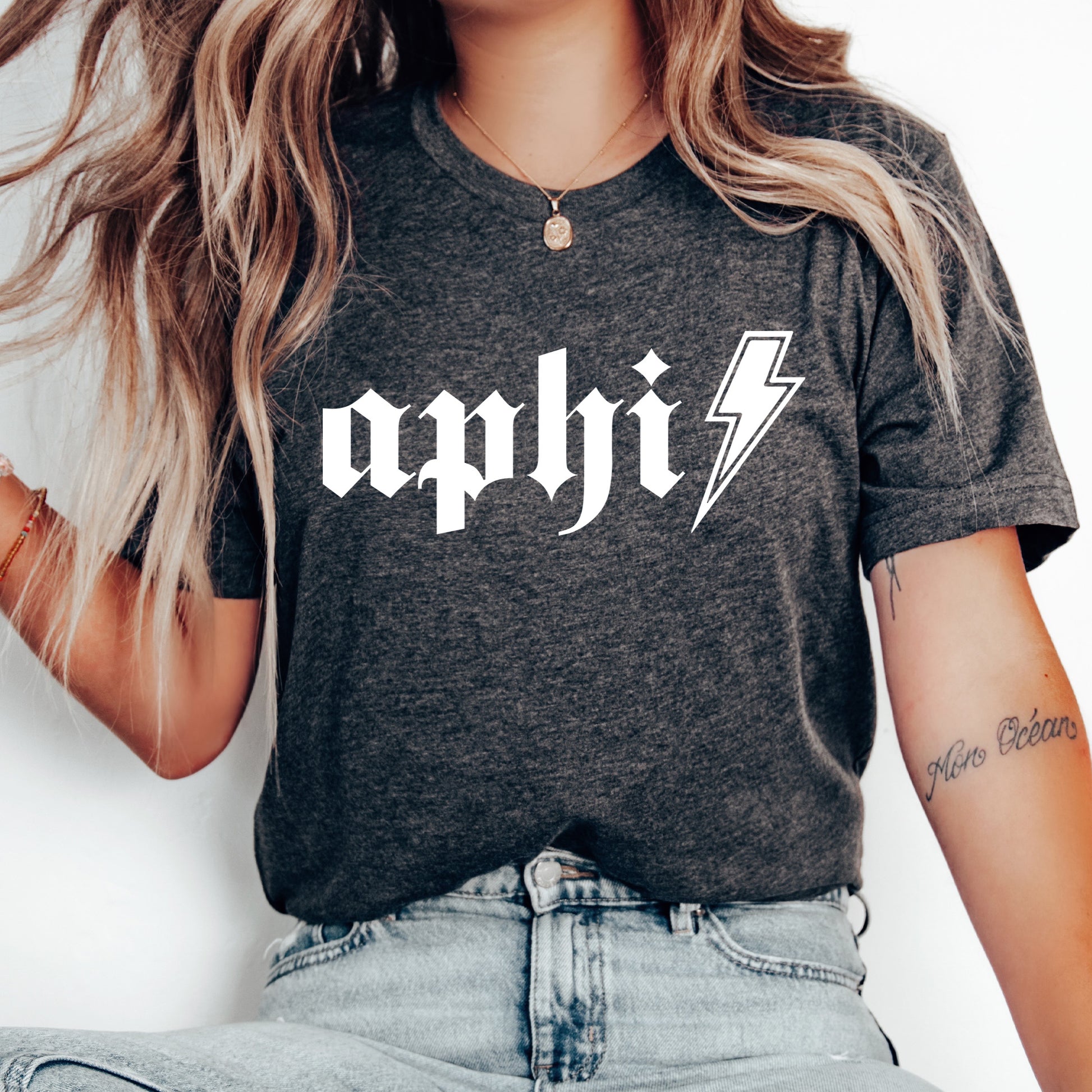 a woman wearing a black shirt with a lightning bolt on it
