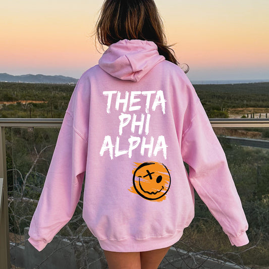 a girl in a pink hoodie that says, thea phi alpha