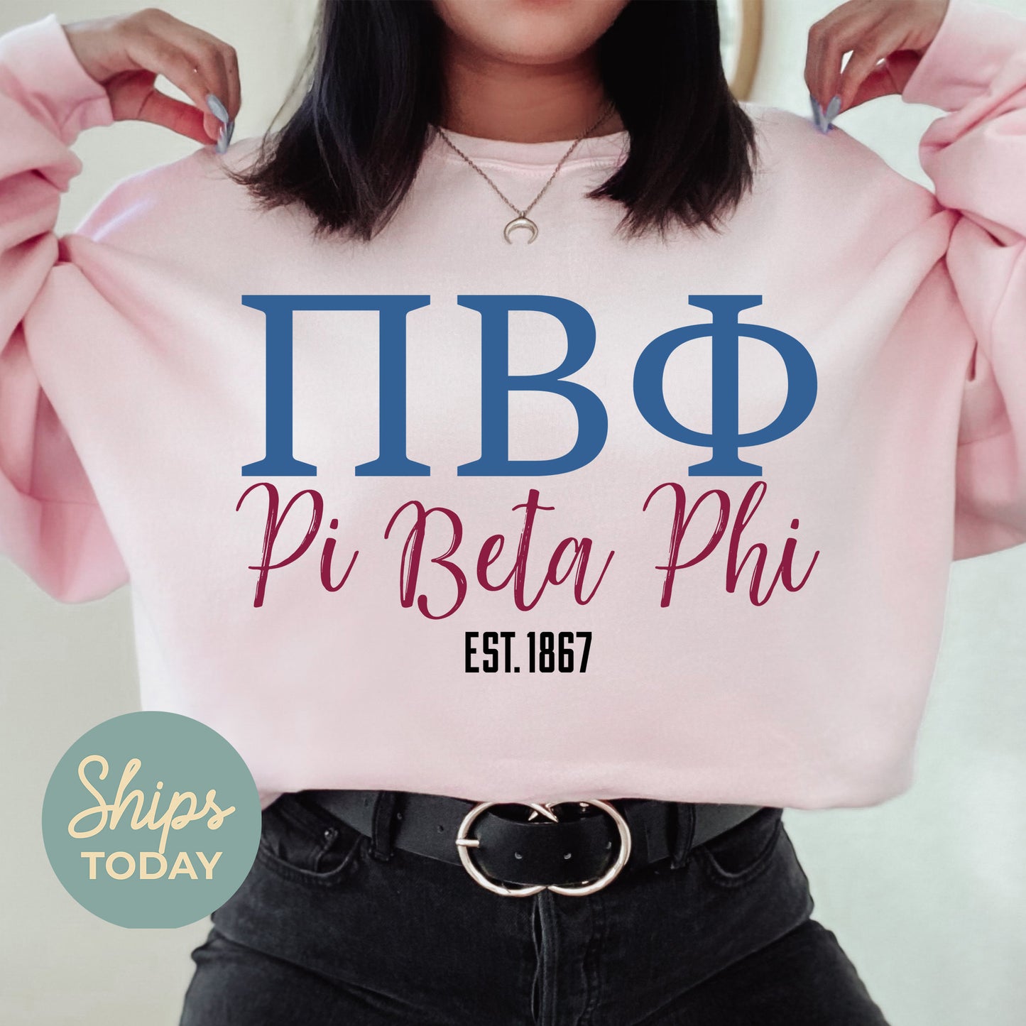 a woman wearing a pink shirt with the words pi bita phi on it