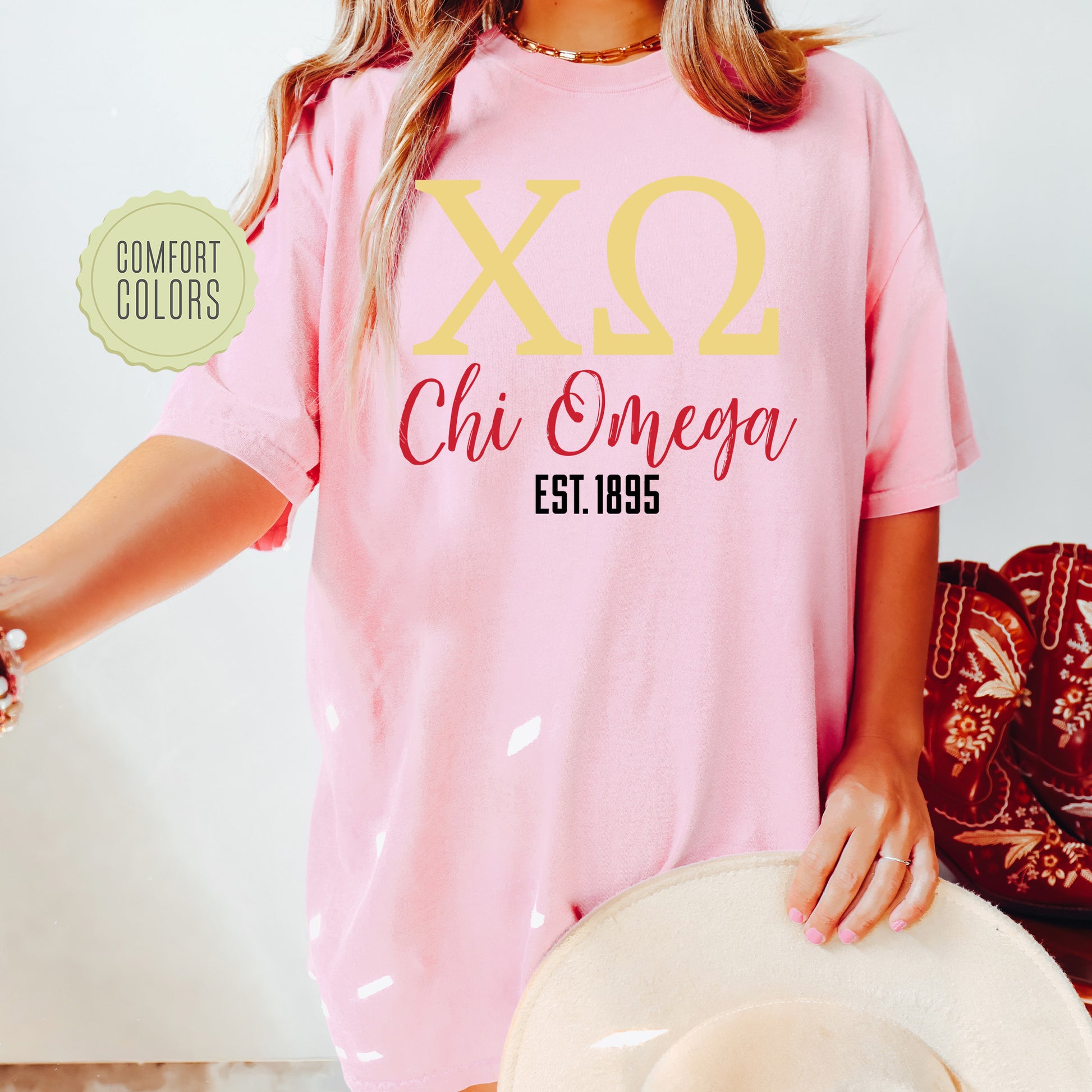 a woman wearing a pink shirt and hat