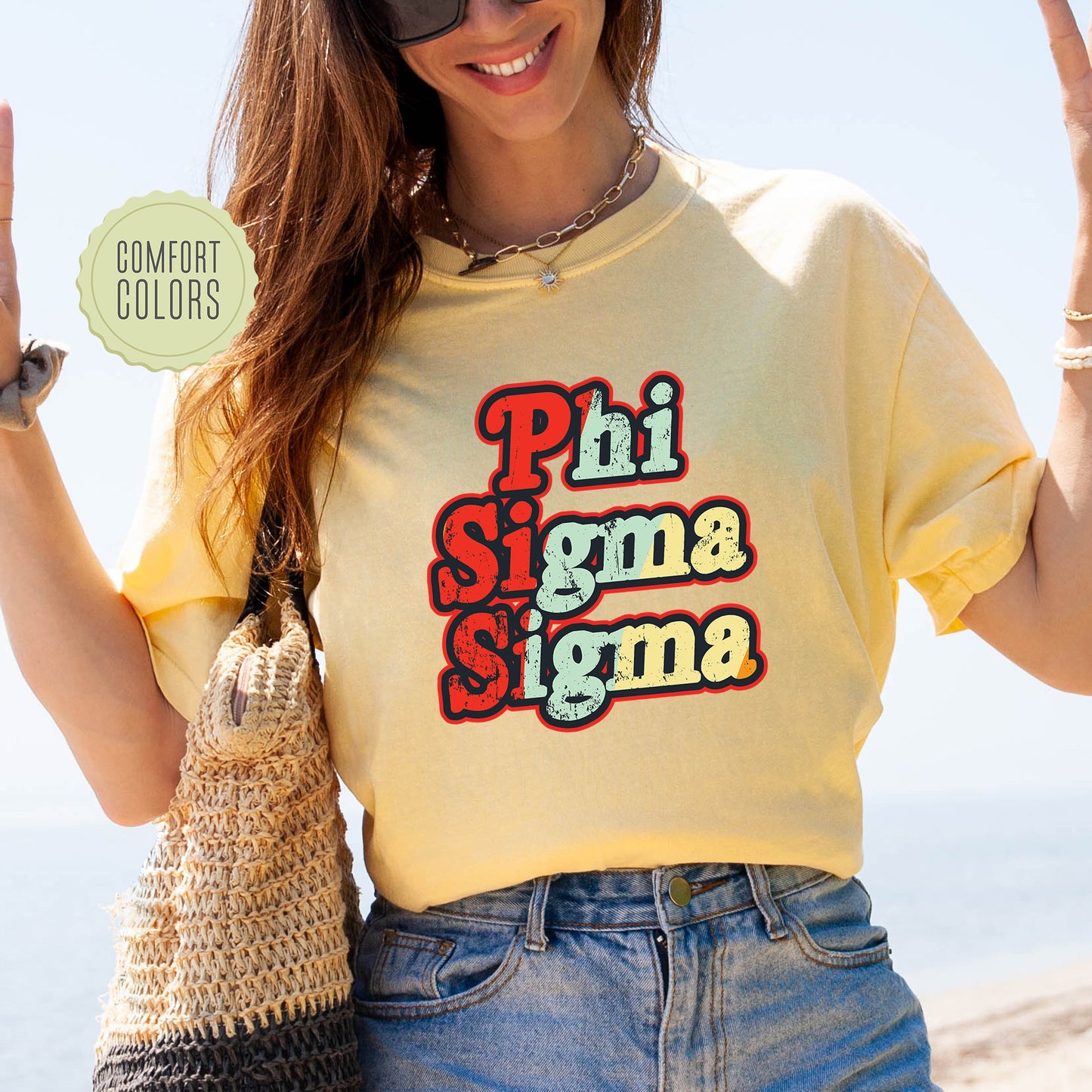 a woman wearing a shirt that says phi sigma stigma
