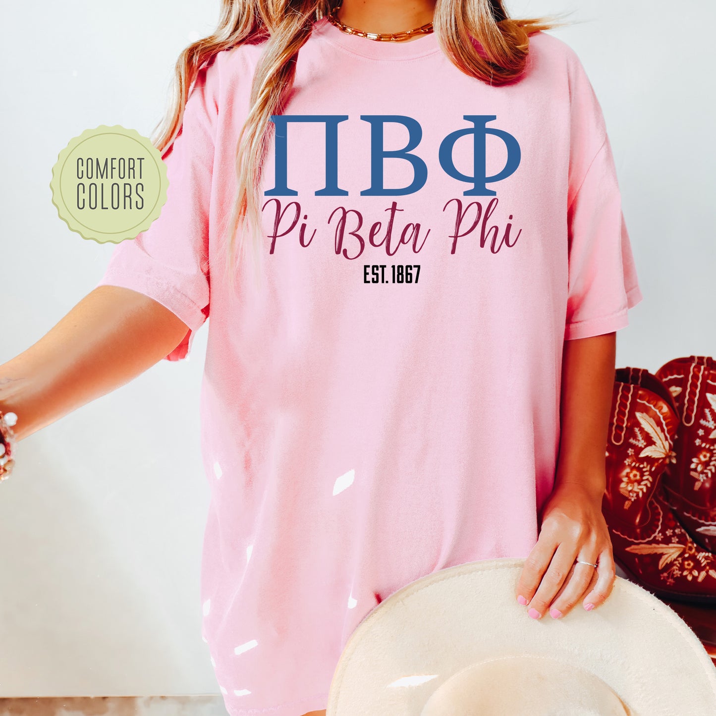 a woman wearing a pink shirt and hat