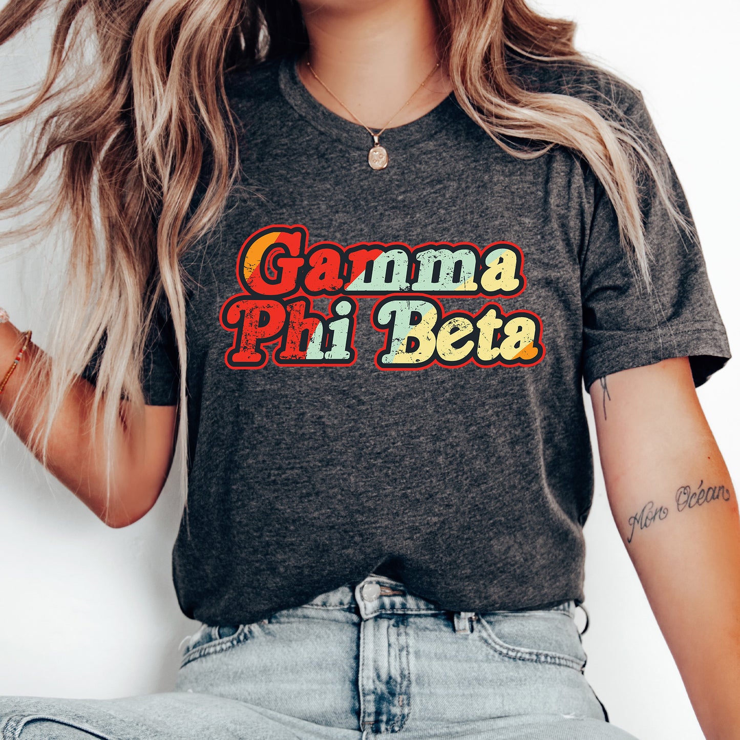 a woman wearing a shirt that says gama pii beta