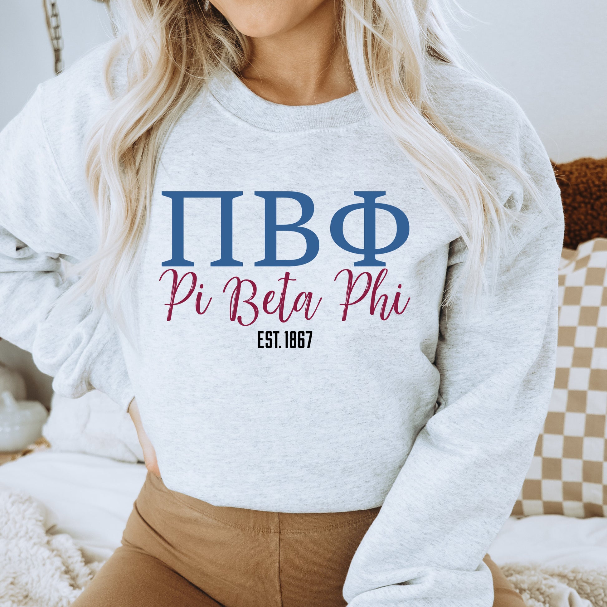 a woman wearing a sweatshirt that says pibo