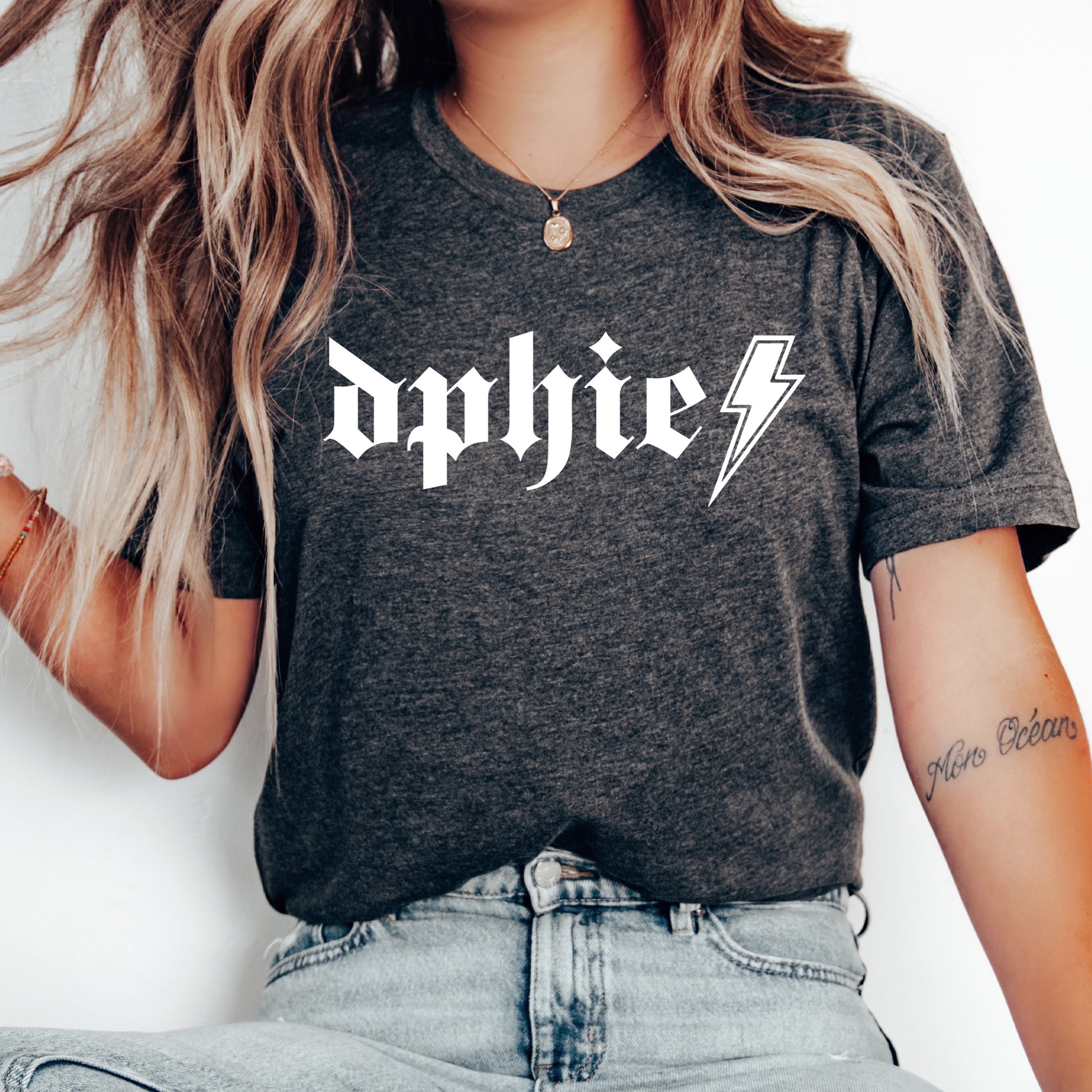 a woman wearing a black shirt with a lightning bolt on it