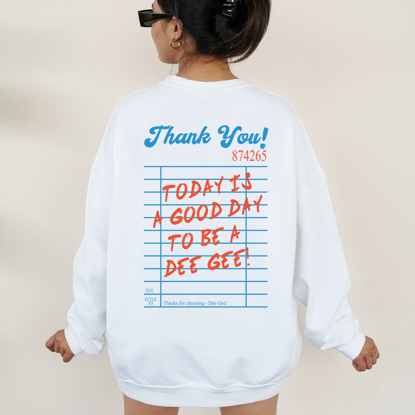 a woman wearing a sweatshirt with writing on it