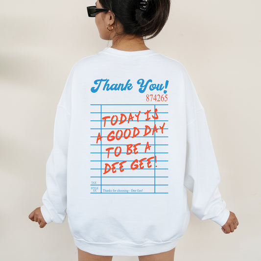 a woman wearing a sweatshirt with writing on it
