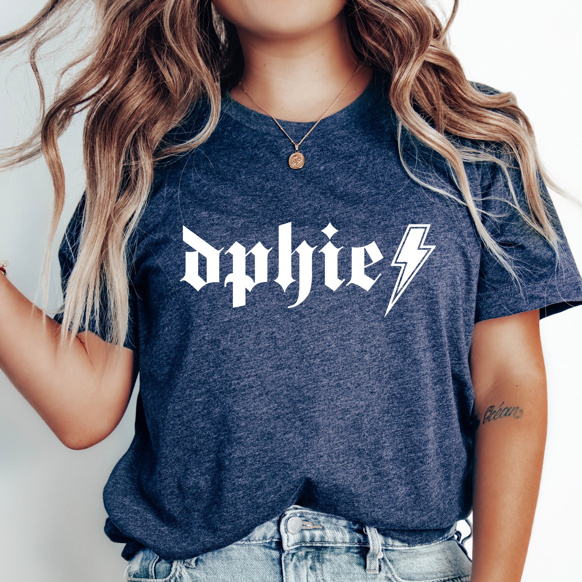 a woman wearing a t - shirt with a lightning bolt on it